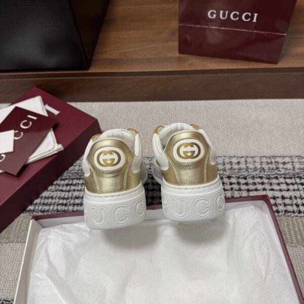 sy_no_86FA7790F9D44F194E522EA0D4CC5C71_7 Gucci Re-Web Sneaker in Metallic Gold & White Leather with Web Stripe