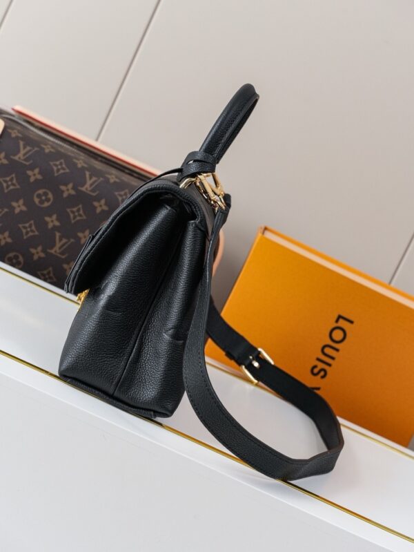 Madeleine Medium Handbag in Monogram Empreinte Embossed Leather