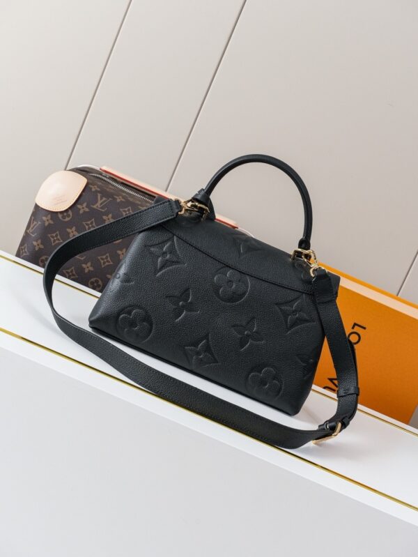 Madeleine Medium Handbag in Monogram Empreinte Embossed Leather