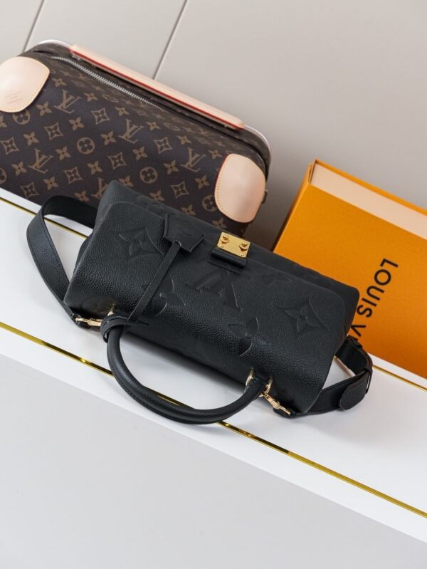 Madeleine Medium Handbag in Monogram Empreinte Embossed Leather