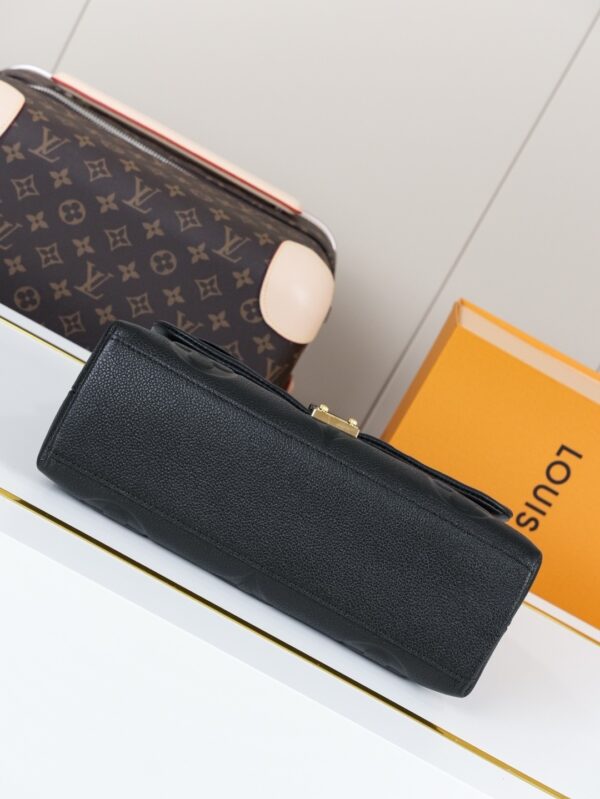 Madeleine Medium Handbag in Monogram Empreinte Embossed Leather