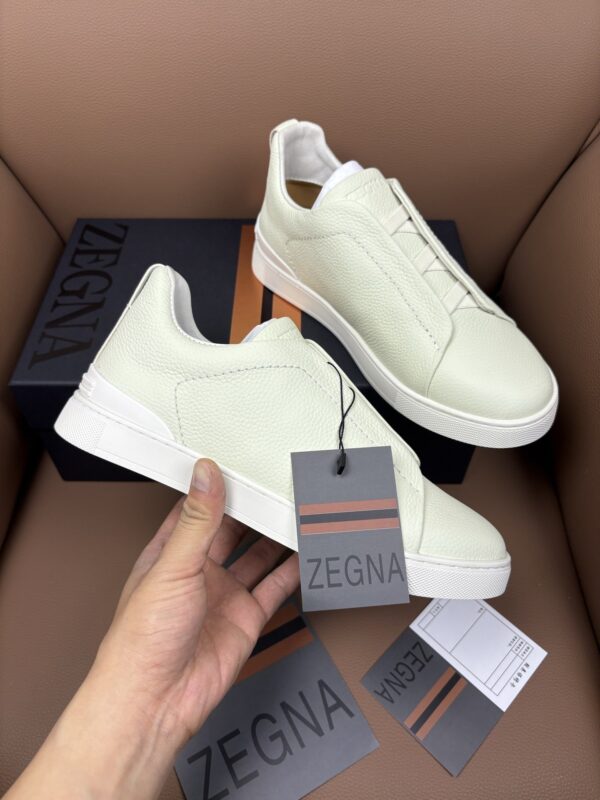 sy_no_8E1A3F917809E6A7942E9329623205E1_0 Off-White & Glacier White Textured Leather Slip-On Sneakers