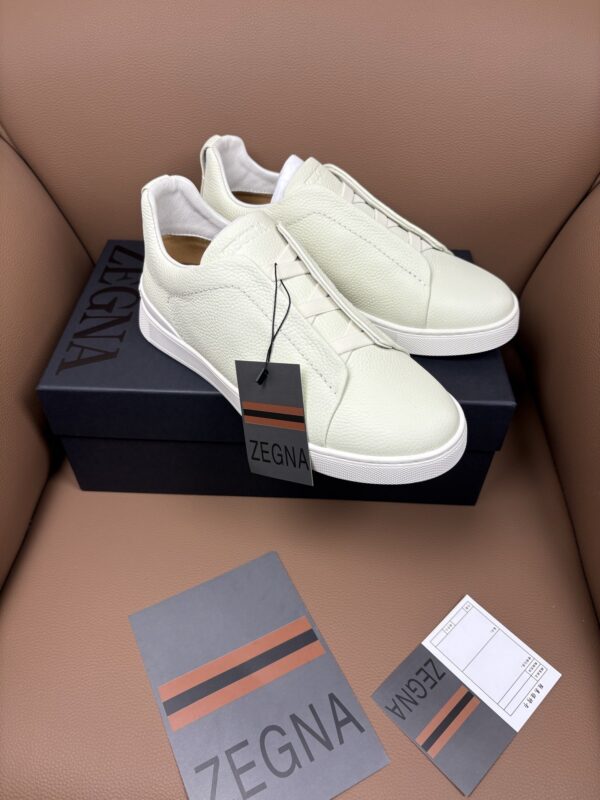 sy_no_8E1A3F917809E6A7942E9329623205E1_2 Off-White & Glacier White Textured Leather Slip-On Sneakers