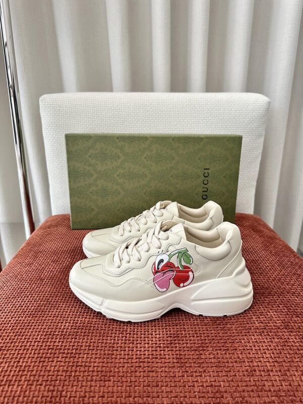 sy_no_B19FB71E6F984A5C2362C7A92C41B479_0 Gucci Rhyton Cherry Print Leather Sneaker in Off-White