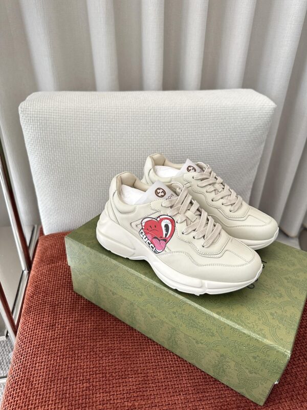 sy_no_B19FB71E6F984A5C2362C7A92C41B479_2 Gucci Rhyton Cherry Print Leather Sneaker in Off-White