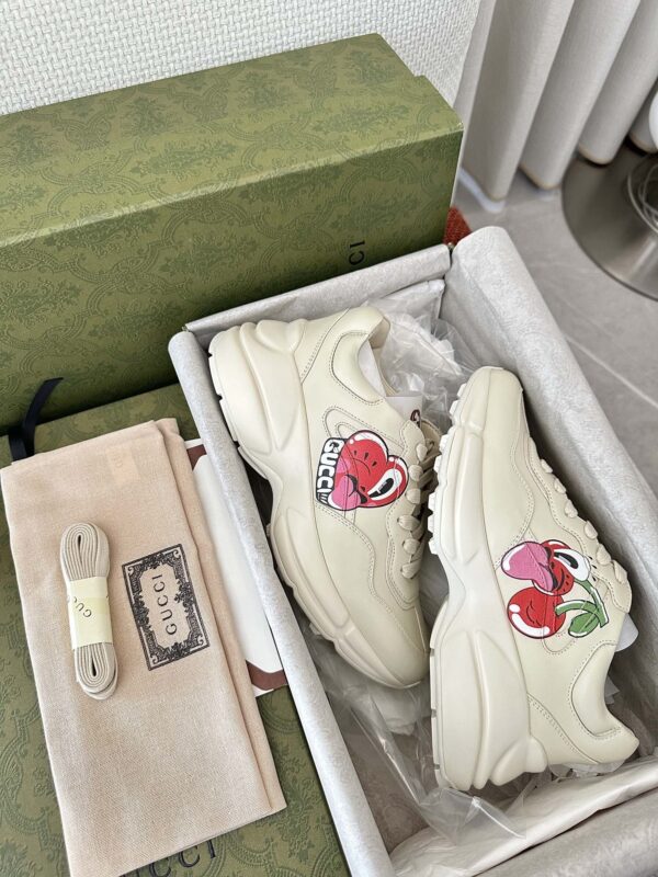 sy_no_B19FB71E6F984A5C2362C7A92C41B479_5 Gucci Rhyton Cherry Print Leather Sneaker in Off-White