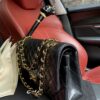 sy_no_BA3037C3101F840EB2D3087C853D4CA8_1 Chanel Classic CF 1112 shoulder bag featuring a chain strap and lock closure, crafted from premium imported caviar-grained calfskin.