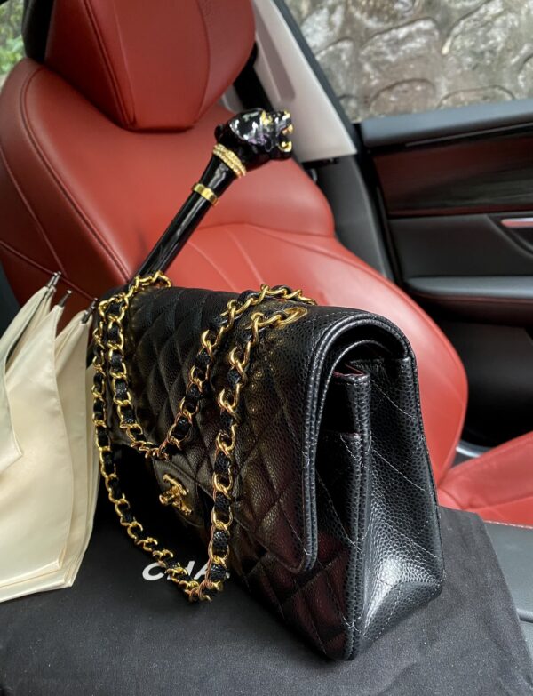 sy_no_BA3037C3101F840EB2D3087C853D4CA8_1 Chanel Classic CF 1112 shoulder bag featuring a chain strap and lock closure, crafted from premium imported caviar-grained calfskin.
