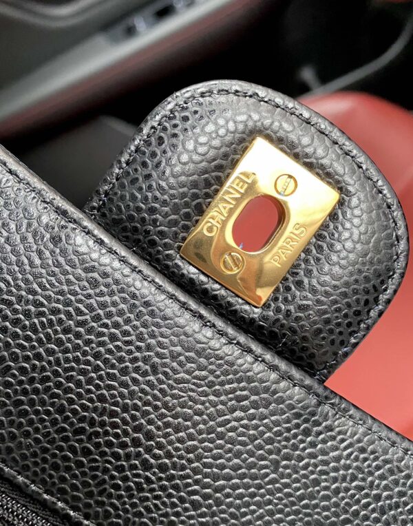 sy_no_BA3037C3101F840EB2D3087C853D4CA8_7 Chanel Classic CF 1112 shoulder bag featuring a chain strap and lock closure, crafted from premium imported caviar-grained calfskin.
