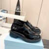 sy_no_DC52EB1AB5D263546D6D53F65E1DBAE9_1 Black Patent Leather Shearling-Lined Platform Loafers