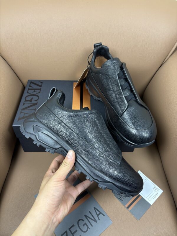sy_no_E195AFA611CC3D538FC5EA334C79C1E0_0 Black Textured Leather Vibram® Lug-Sole Slip-On Sneakers