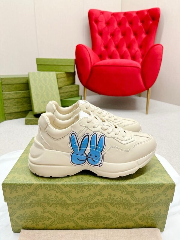 sy_no_E6E22C15A7144F701AD72E69E987799D_0 Gucci Rhyton Leather Sneaker in Off-White