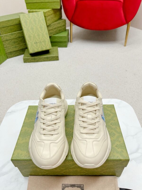 sy_no_E6E22C15A7144F701AD72E69E987799D_1 Gucci Rhyton Leather Sneaker in Off-White