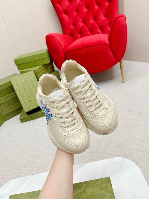 sy_no_E6E22C15A7144F701AD72E69E987799D_2 Gucci Rhyton Leather Sneaker in Off-White