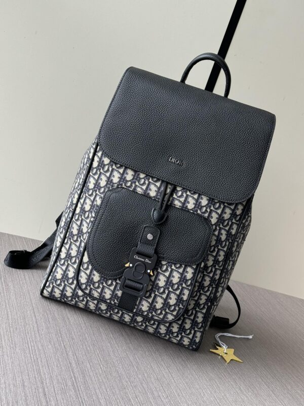 sy_no_EC06179A174B03C6FB23A73136FFCC96_0 Dior Motion Saddle Backpack – Blue Oblique & Black Grained Leather