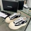 sy_no_04935DB51745B47700A8AB87CE51B4AF_0 Chanel Black and White Canvas Platform Low-Top Sneaker with Ribbed Sole and CC Logo