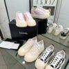 sy_no_04935DB51745B47700A8AB87CE51B4AF_1 Chanel Black and White Canvas Platform Low-Top Sneaker with Ribbed Sole and CC Logo