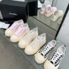 sy_no_04935DB51745B47700A8AB87CE51B4AF_2 Chanel Black and White Canvas Platform Low-Top Sneaker with Ribbed Sole and CC Logo