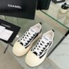 sy_no_04935DB51745B47700A8AB87CE51B4AF_3 Chanel Black and White Canvas Platform Low-Top Sneaker with Ribbed Sole and CC Logo