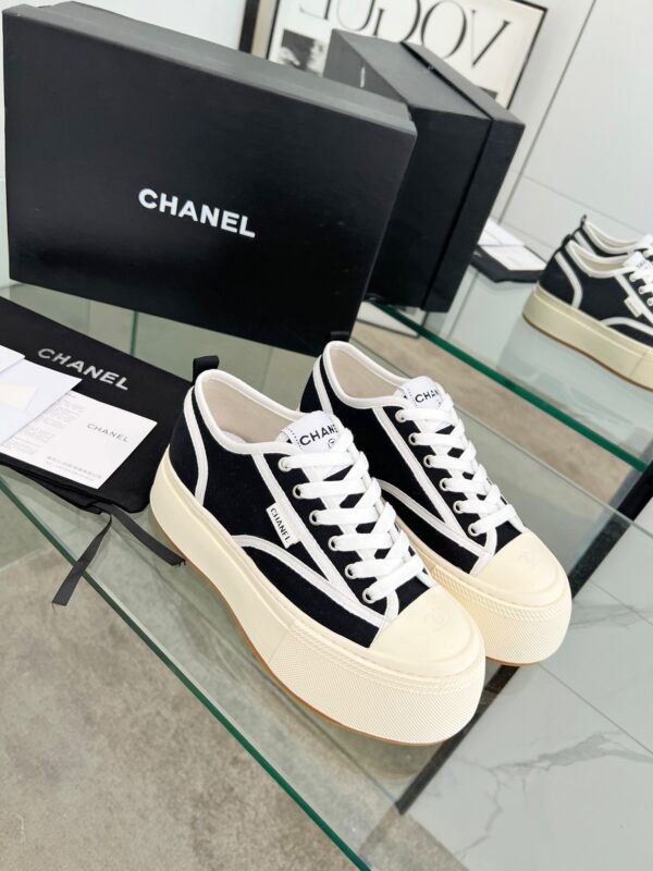 sy_no_04935DB51745B47700A8AB87CE51B4AF_4 Chanel Black and White Canvas Platform Low-Top Sneaker with Ribbed Sole and CC Logo