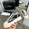 sy_no_04935DB51745B47700A8AB87CE51B4AF_5 Chanel Black and White Canvas Platform Low-Top Sneaker with Ribbed Sole and CC Logo