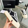 sy_no_04935DB51745B47700A8AB87CE51B4AF_6 Chanel Black and White Canvas Platform Low-Top Sneaker with Ribbed Sole and CC Logo