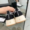 sy_no_04935DB51745B47700A8AB87CE51B4AF_7 Chanel Black and White Canvas Platform Low-Top Sneaker with Ribbed Sole and CC Logo