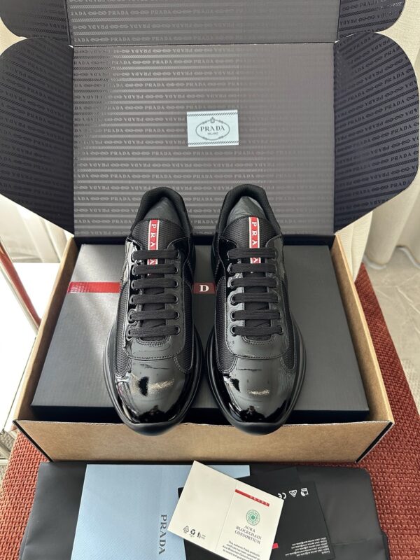 sy_no_0F83A49262B2D1F03078243D417D72E9_0 Prada Black Patent Mesh Red Label Sneaker