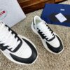 sy_no_10BE1484FA39D03407E0AA139E9EA24F_3 Prada Black White Leather Triangle Chunky Sneaker