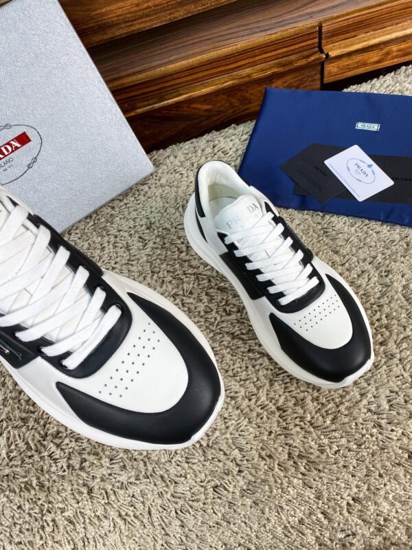 sy_no_10BE1484FA39D03407E0AA139E9EA24F_3 Prada Black White Leather Triangle Chunky Sneaker