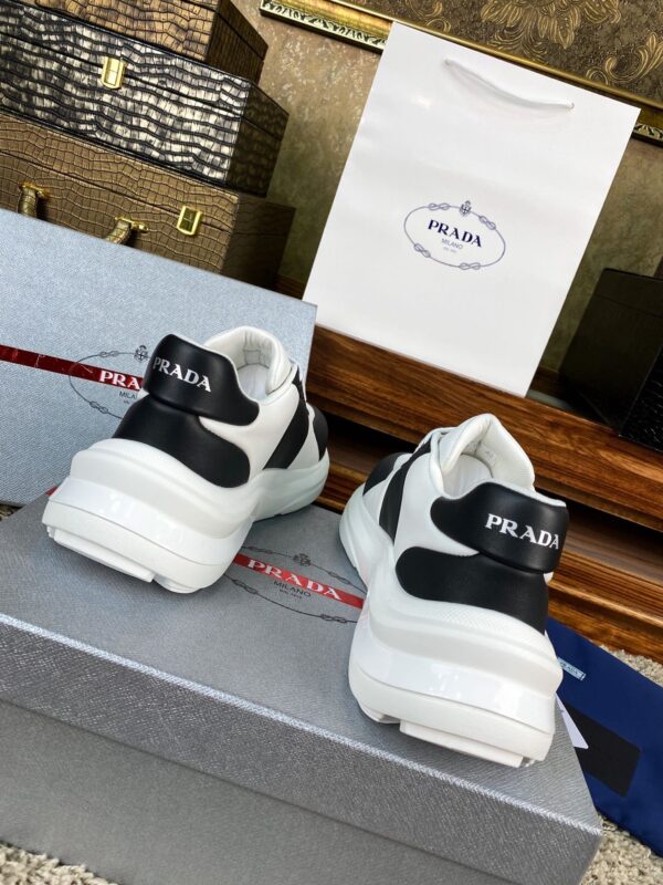 sy_no_10BE1484FA39D03407E0AA139E9EA24F_7 Prada Black White Leather Triangle Chunky Sneaker