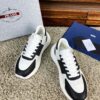 sy_no_10BE1484FA39D03407E0AA139E9EA24F_8 Prada Black White Leather Triangle Chunky Sneaker