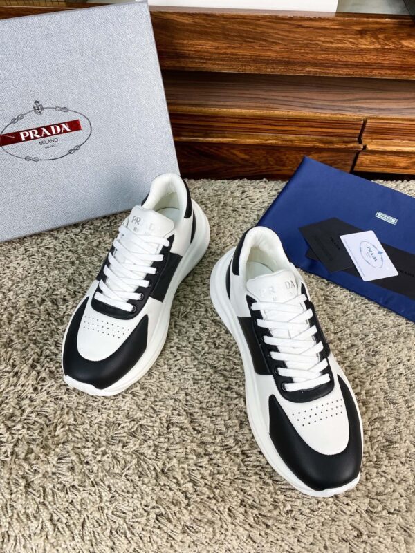 sy_no_10BE1484FA39D03407E0AA139E9EA24F_8 Prada Black White Leather Triangle Chunky Sneaker
