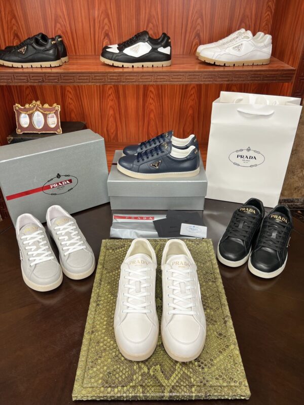 sy_no_136711FF87369E866713A53F55BA6C5C_0 Prada Off-White Leather Metal-Triangle Vulcanized-Sole Sneaker