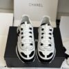 sy_no_1629F2D60DE02E8BE6ED73BFF8A99919_1 Chanel White and Black Leather Low-Top Sneaker with Suede Toe Cap and CC Logo