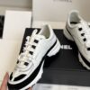 sy_no_1629F2D60DE02E8BE6ED73BFF8A99919_5 Chanel White and Black Leather Low-Top Sneaker with Suede Toe Cap and CC Logo