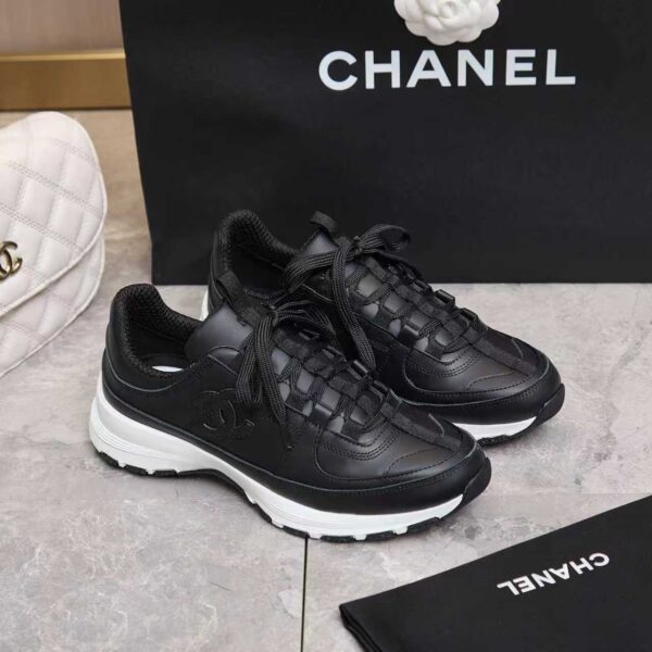sy_no_1D482E6308BEACE629766C721B814D19_0 Chanel All-Black Leather Low-Top Sneaker with Tonal CC Logo and White Midsole