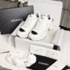 Chanel White and Black Leather Low-Top Sneaker with Cap-Toe and CC Logo