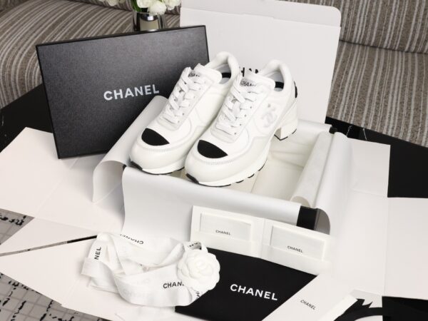 Chanel White and Black Leather Low-Top Sneaker with Cap-Toe and CC Logo