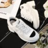 Chanel White and Black Leather Low-Top Sneaker with Cap-Toe and CC Logo