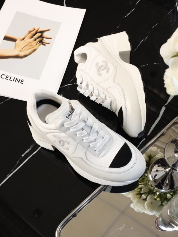 Chanel White and Black Leather Low-Top Sneaker with Cap-Toe and CC Logo