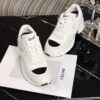 Chanel White and Black Leather Low-Top Sneaker with Cap-Toe and CC Logo
