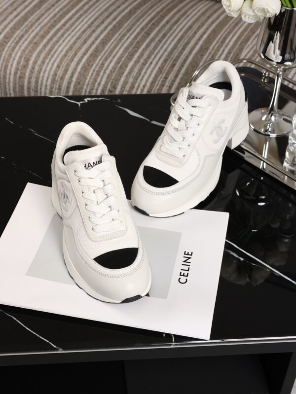 Chanel White and Black Leather Low-Top Sneaker with Cap-Toe and CC Logo