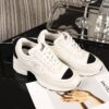 Chanel White and Black Leather Low-Top Sneaker with Cap-Toe and CC Logo