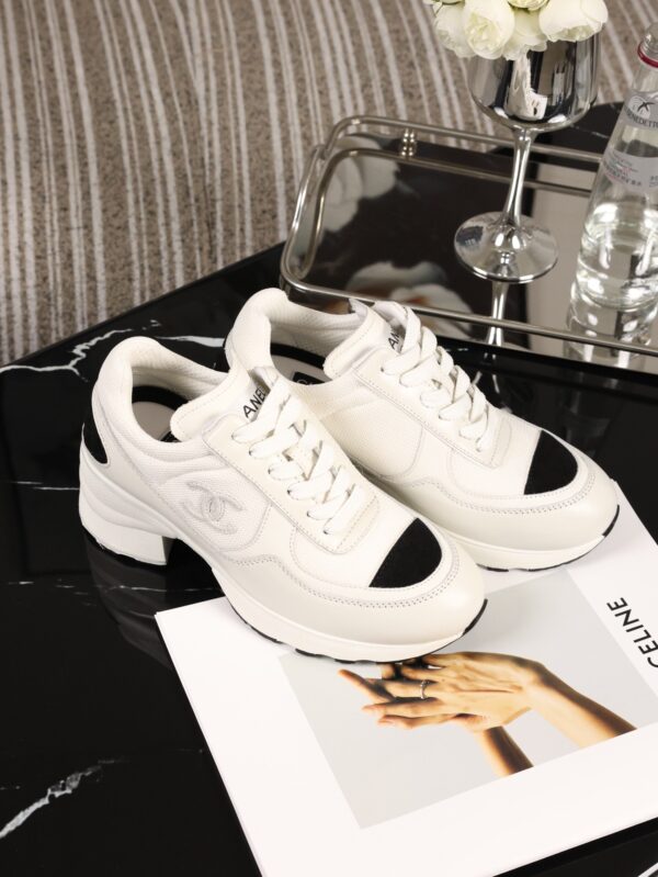Chanel White and Black Leather Low-Top Sneaker with Cap-Toe and CC Logo