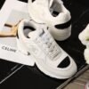 Chanel White and Black Leather Low-Top Sneaker with Cap-Toe and CC Logo