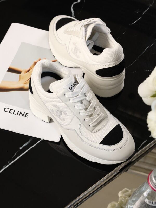 Chanel White and Black Leather Low-Top Sneaker with Cap-Toe and CC Logo