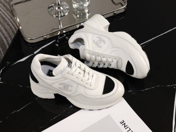 Chanel White and Black Leather Low-Top Sneaker with Cap-Toe and CC Logo
