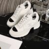 Chanel White and Black Leather Low-Top Sneaker with Cap-Toe and CC Logo