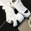 Chanel White and Black Leather Low-Top Sneaker with Cap-Toe and CC Logo